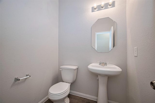 24710 Landolfi Dr, Katy, TX 77493 - half bath featuring toilet, wood finished floors, and a sink