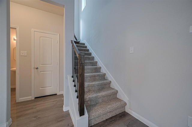24710 Landolfi Dr, Katy, TX 77493 - stairway featuring wood finished floors and baseboards
