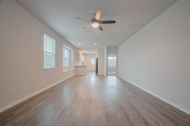24710 Landolfi Dr, Katy, TX 77493 - unfurnished living room featuring ceiling fan, wood finished floors, baseboards, and recessed lighting