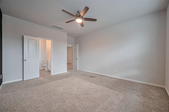 24710 Landolfi Dr, Katy, TX 77493 - unfurnished bedroom with light carpet, baseboards, ensuite bathroom, and ceiling fan