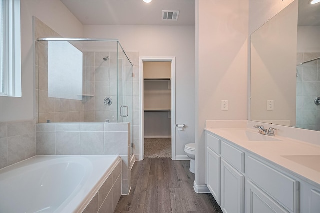 24710 Landolfi Dr, Katy, TX 77493 - bathroom with a shower stall, wood finished floors, a garden tub, double vanity, and toilet
