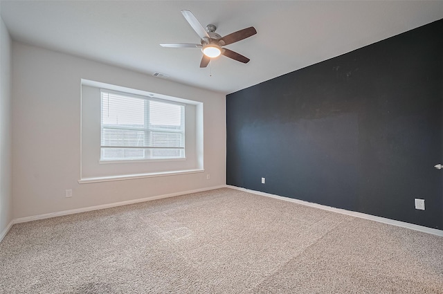 24710 Landolfi Dr, Katy, TX 77493 - spare room featuring a ceiling fan, carpet, and baseboards