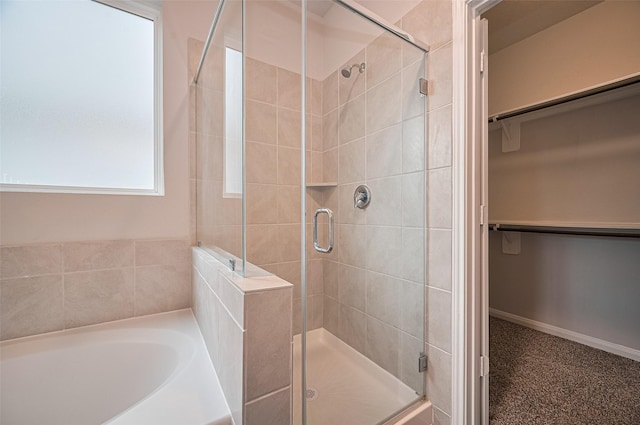 24710 Landolfi Dr, Katy, TX 77493 - full bath featuring a stall shower, a walk in closet, and a bath