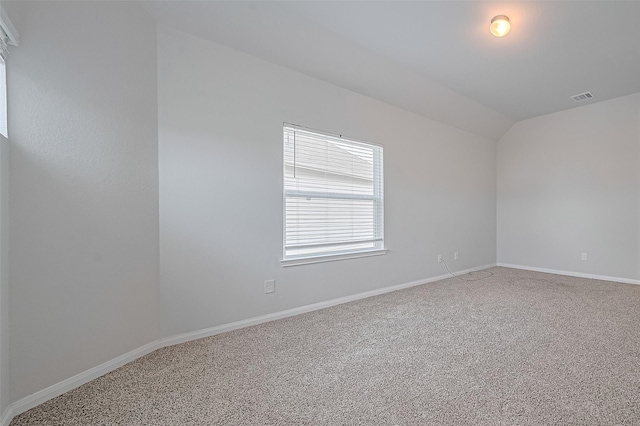 24710 Landolfi Dr, Katy, TX 77493 - spare room featuring carpet flooring, lofted ceiling, and baseboards