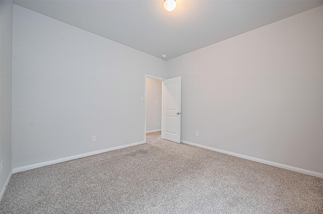 24710 Landolfi Dr, Katy, TX 77493 - empty room featuring light colored carpet, baseboards, and lofted ceiling