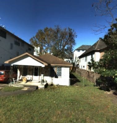 5114 Eigel St, Houston, TX 77007 - back of property featuring a lawn and a patio