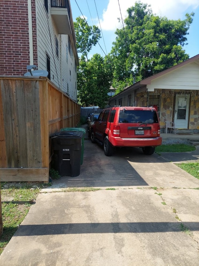 5114 Eigel St, Houston, TX 77007 - view of side of property featuring brick siding and driveway
