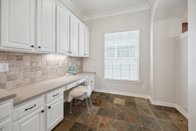 5405 Blossom St, Houston, TX 77007 - office featuring built in desk, ornamental molding, baseboards, and dark stone finish flooring