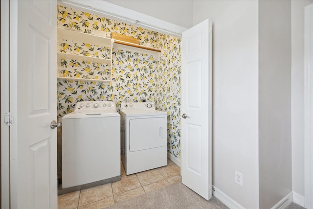 5405 Blossom St, Houston, TX 77007 - laundry area featuring wallpapered walls, washer and clothes dryer, baseboards, and light tile patterned floors