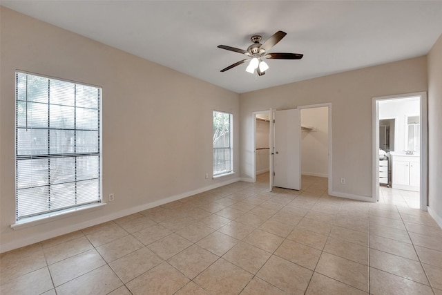 4111 Wildacres Dr, Houston, TX 77072 - unfurnished bedroom featuring light tile patterned floors, baseboards, and a spacious closet