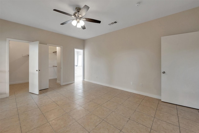 4111 Wildacres Dr, Houston, TX 77072 - spare room featuring light tile patterned floors, ceiling fan, a smoke detector, and baseboards