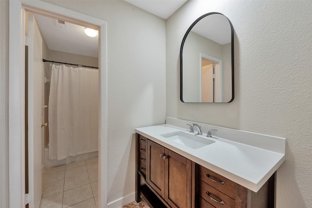 4111 Wildacres Dr, Houston, TX 77072 - bathroom featuring vanity, a textured wall, and tile patterned floors