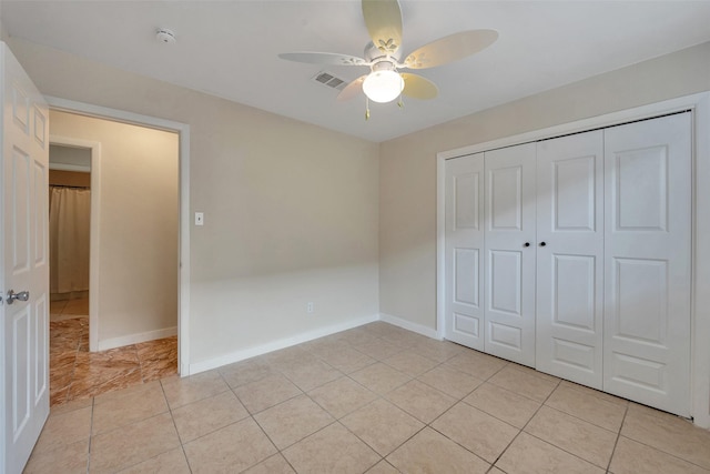 4111 Wildacres Dr, Houston, TX 77072 - unfurnished bedroom with a closet, light tile patterned flooring, baseboards, and ceiling fan