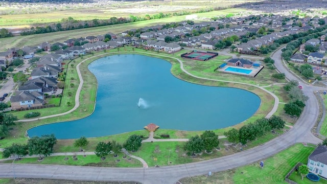 aerial overview of property's location featuring a large body of water and nearby suburban area