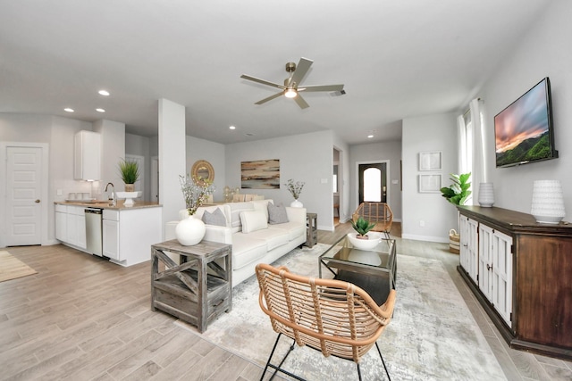 2142 Emerald Diamond Ct, Fresno, TX 77545 - living area with ceiling fan, recessed lighting, light wood-type flooring, and baseboards