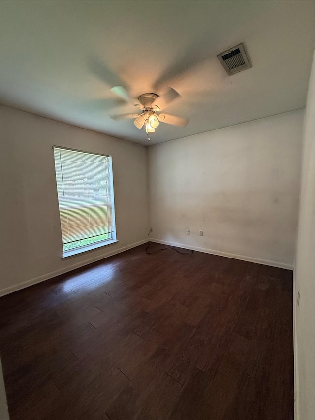 624 Houston St, West Columbia, TX 77486 - spare room featuring a ceiling fan, dark wood finished floors, and baseboards