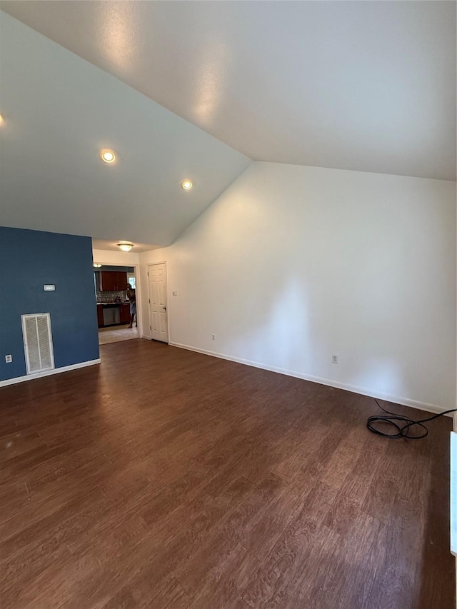 624 Houston St, West Columbia, TX 77486 - unfurnished living room featuring lofted ceiling, dark wood finished floors, baseboards, and recessed lighting
