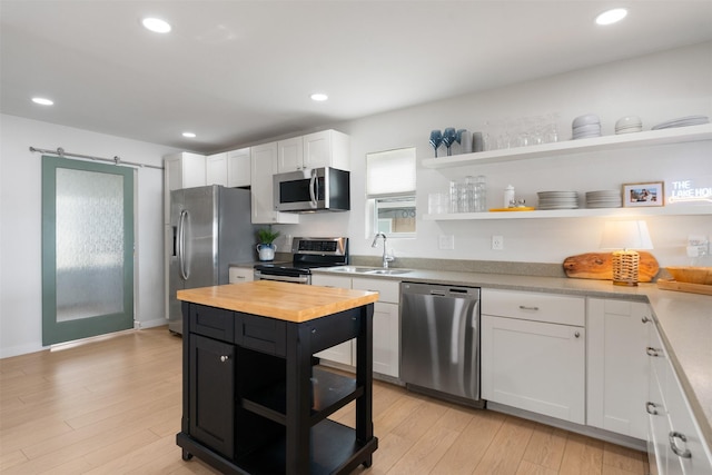 175 Autumn Wood Trl, Gun Barrel City, TX 75156 - kitchen featuring appliances with stainless steel finishes, open shelves, butcher block countertops, a sink, and recessed lighting