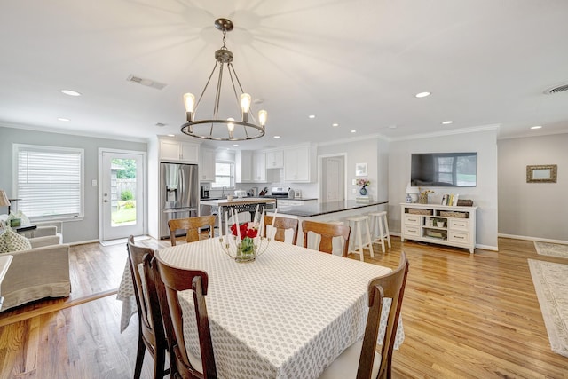 1023 Waltway Dr, Houston, TX 77008 - dining area featuring a chandelier, ornamental molding, light wood-type flooring, recessed lighting, and baseboards
