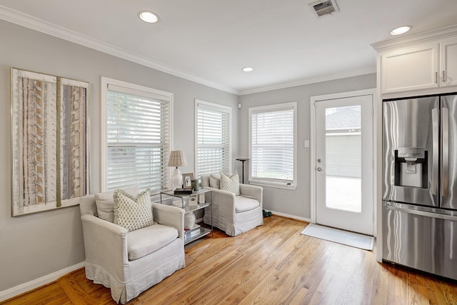 1023 Waltway Dr, Houston, TX 77008 - living area featuring baseboards, ornamental molding, light wood finished floors, and recessed lighting