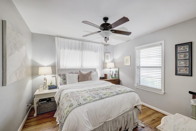 1023 Waltway Dr, Houston, TX 77008 - bedroom with baseboards, wood finished floors, and ceiling fan