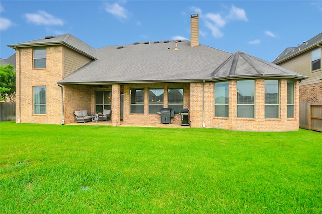 2810 Red Maple Dr, Katy, TX 77494 - rear view of property featuring a patio area, a chimney, brick siding, and outdoor lounge area