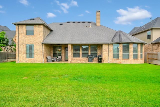 2810 Red Maple Dr, Katy, TX 77494 - back of property featuring brick siding, a patio, and a chimney