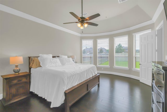 2810 Red Maple Dr, Katy, TX 77494 - bedroom with dark wood finished floors, baseboards, ornamental molding, ceiling fan, and a tray ceiling