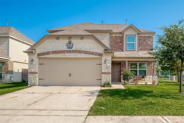 15319 Meandering Post Trl, Houston, TX 77044 - view of front of property with brick siding, a front lawn, stone siding, and an attached garage