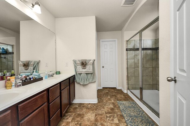 15319 Meandering Post Trl, Houston, TX 77044 - bathroom with double vanity, a shower stall, and baseboards