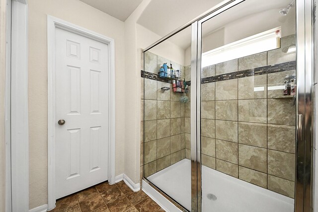 15319 Meandering Post Trl, Houston, TX 77044 - bathroom featuring a stall shower and baseboards