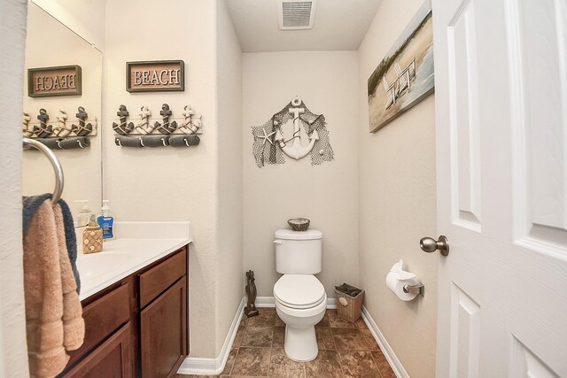 15319 Meandering Post Trl, Houston, TX 77044 - half bath featuring vanity, toilet, baseboards, and tile patterned floors