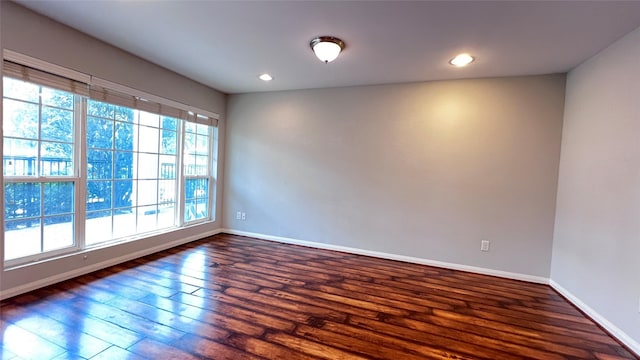 5333 Richmond Ave Unit 16, Houston, TX 77056 - spare room featuring dark wood-style floors, baseboards, and recessed lighting