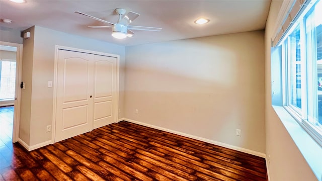 5333 Richmond Ave Unit 16, Houston, TX 77056 - unfurnished bedroom with baseboards, dark wood finished floors, and recessed lighting