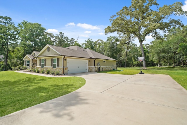 26410 Yaupon Crk, Magnolia, TX 77355 - view of side of home featuring stone siding, a lawn, concrete driveway, a garage, and view of scattered trees