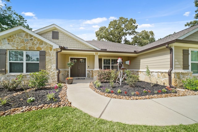 26410 Yaupon Crk, Magnolia, TX 77355 - view of front of home with stone siding and roof with shingles