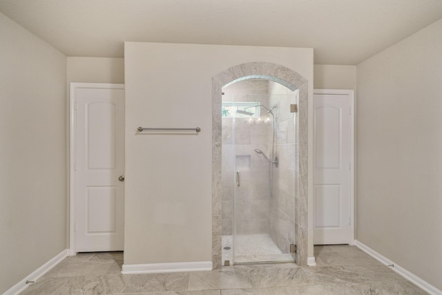 26410 Yaupon Crk, Magnolia, TX 77355 - full bathroom featuring baseboards and a shower stall