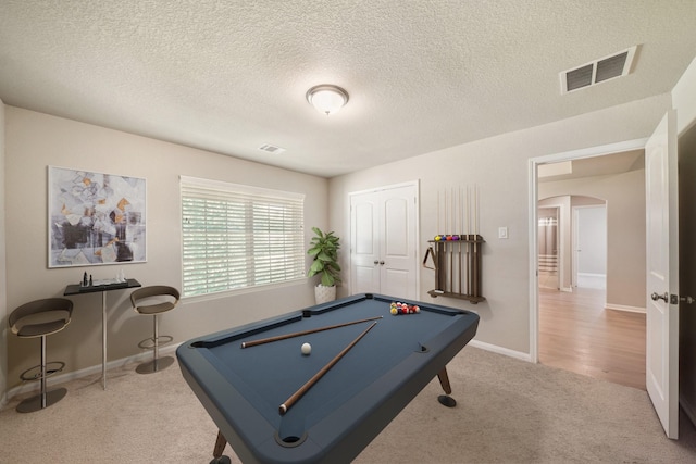 26410 Yaupon Crk, Magnolia, TX 77355 - playroom featuring carpet flooring, arched walkways, billiards table, a textured ceiling, and baseboards
