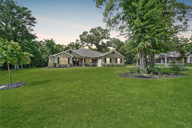 26410 Yaupon Crk, Magnolia, TX 77355 - ranch-style home with a front lawn and stone siding