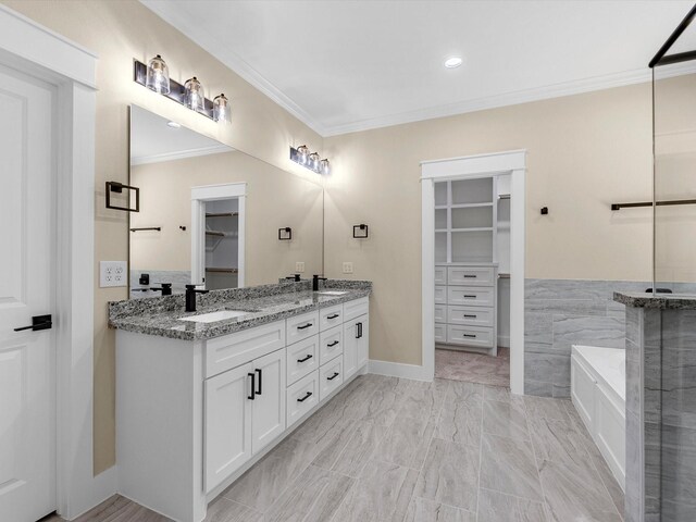 1197 Rd 660, Dayton, TX 77535 - bathroom with a walk in closet, ornamental molding, double vanity, and recessed lighting