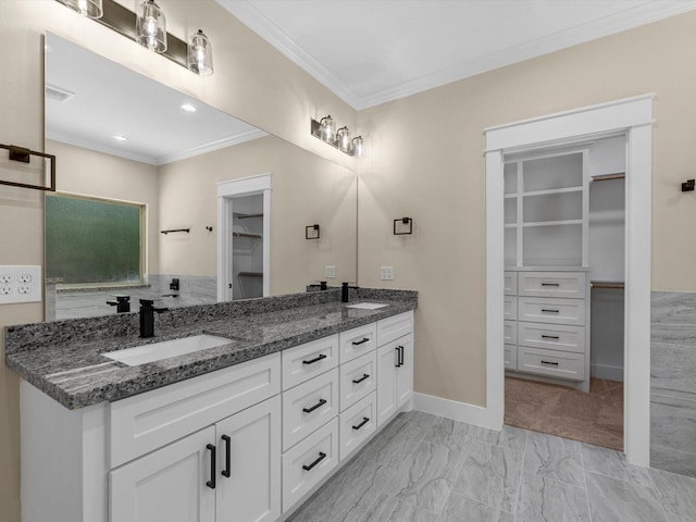 1197 Rd 660, Dayton, TX 77535 - bathroom featuring crown molding, double vanity, a spacious closet, and marble finish flooring