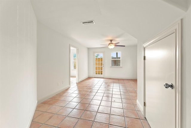 4015 Garrott St, Houston, TX 77006 - unfurnished room featuring a ceiling fan, baseboards, and light tile patterned floors