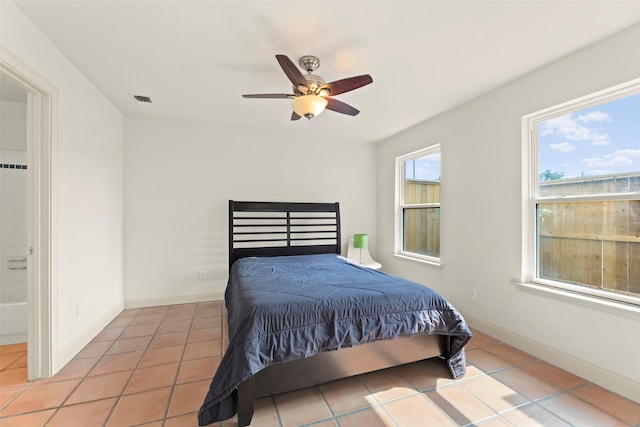 4015 Garrott St, Houston, TX 77006 - bedroom featuring tile patterned floors, ceiling fan, and baseboards
