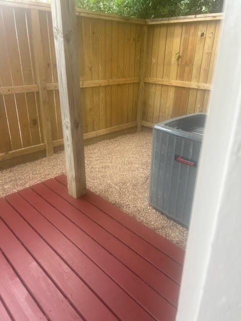 4015 Garrott St, Houston, TX 77006 - wooden deck with central air condition unit