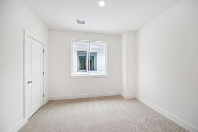 1544 W Tidwell Rd, Houston, TX 77091 - spare room featuring light colored carpet and baseboards