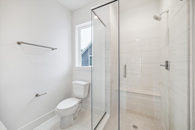 1544 W Tidwell Rd, Houston, TX 77091 - bathroom featuring toilet, a stall shower, baseboards, and tile patterned flooring