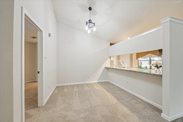 1018 W Castlewood Ave, Friendswood, TX 77546 - unfurnished living room featuring carpet flooring, baseboards, a sink, and lofted ceiling