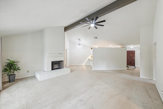 1018 W Castlewood Ave, Friendswood, TX 77546 - unfurnished living room featuring carpet, ceiling fan, beamed ceiling, a brick fireplace, and high vaulted ceiling