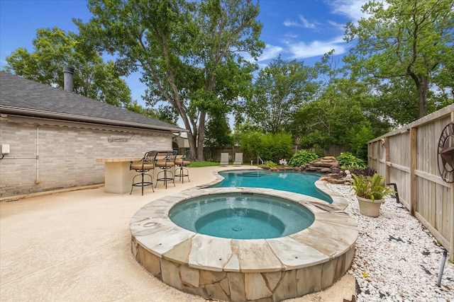 1018 W Castlewood Ave, Friendswood, TX 77546 - view of swimming pool with a fenced backyard, a patio area, and a pool with connected hot tub