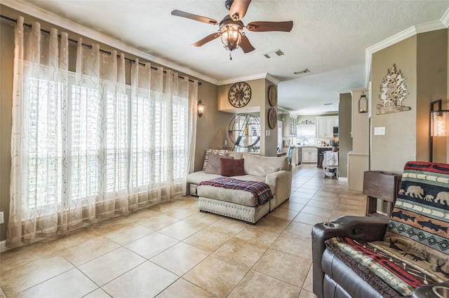 1914 Tipperary Dr, Deer Park, TX 77536 - living area featuring ceiling fan, light tile patterned floors, crown molding, and a textured ceiling